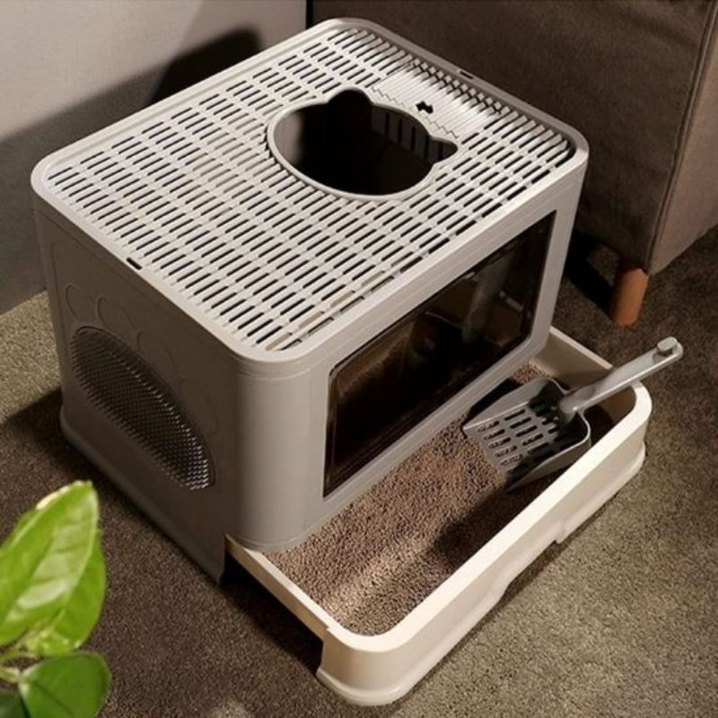 Maison de toilette pour chat avec design moderne intégré dans un salon contemporain