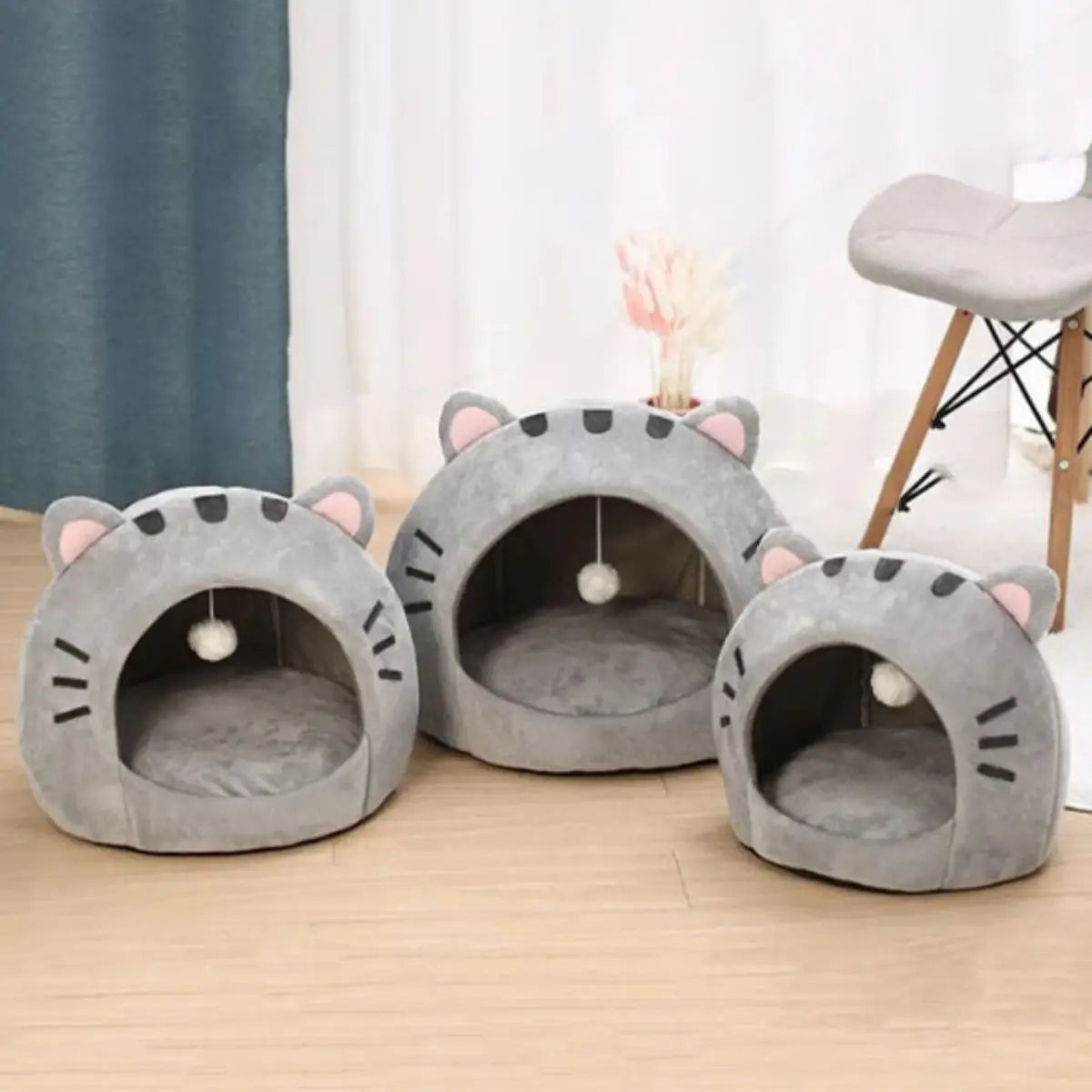 Niche pour chat en forme d'oreilles de chat, design gris confortable et moderne.