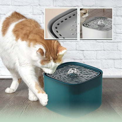 Fontaine à eau chat Un chat boit paisiblement à une fontaine électrique silencieuse alimentée par USB, parfaitement intégrée dans un intérieur calme.