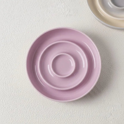 Gamelle Pour Chat design en spirale de couleur rose, idéale pour votre compagnon.