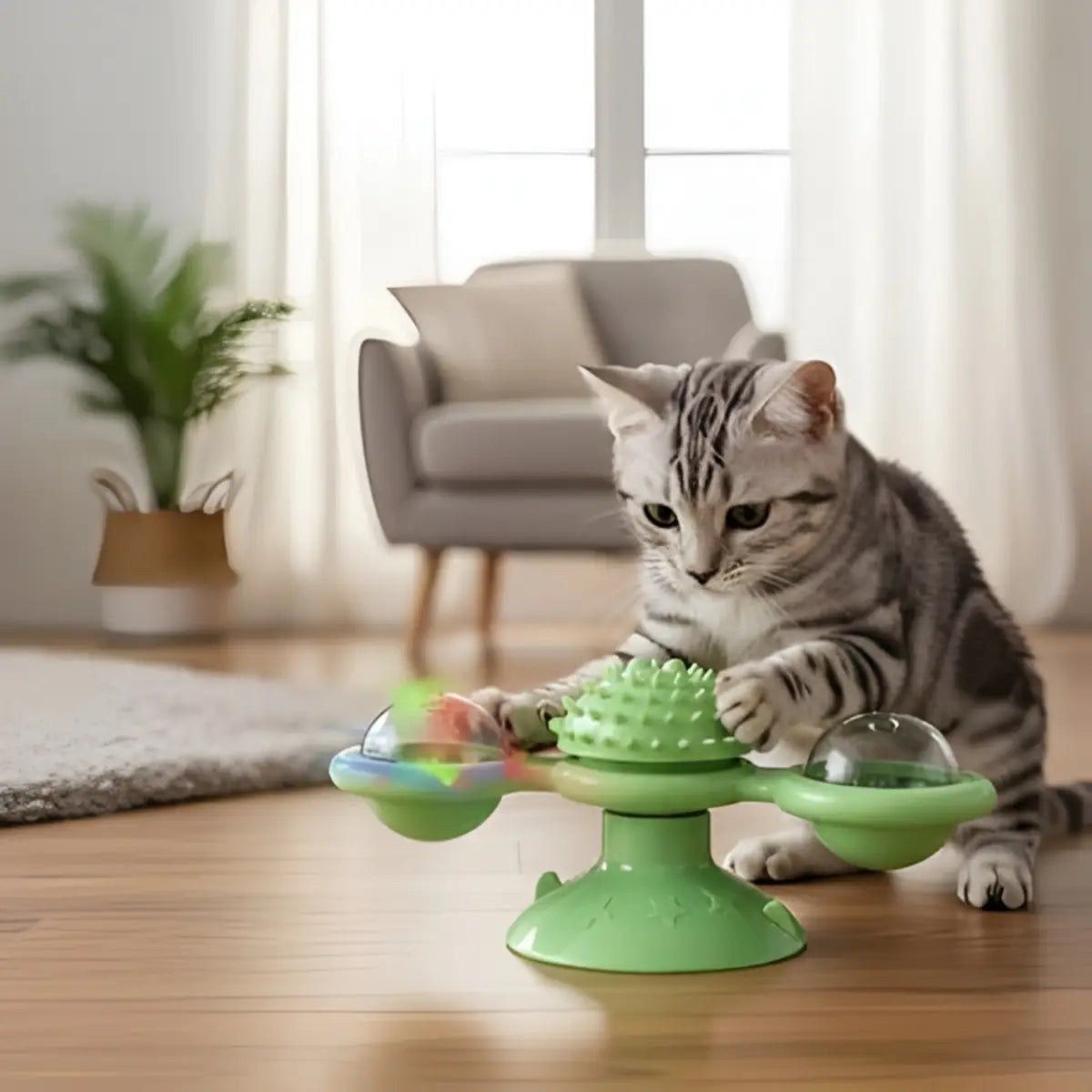 jouet chat interactif vert avec éléments rotatifs et un chat jouant dessus