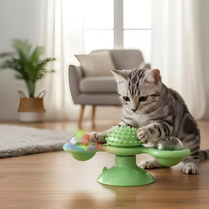 jouet chat interactif vert avec éléments rotatifs et un chat jouant dessus