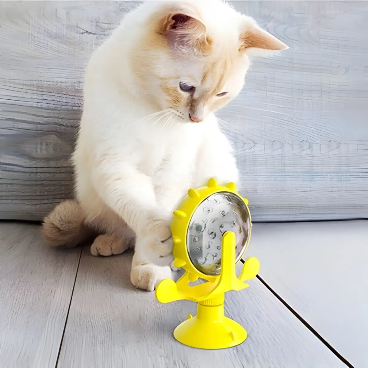 jouet pour chat jaune interactif MiaouSpin avec ventouse, idéal pour divertir votre animal.
