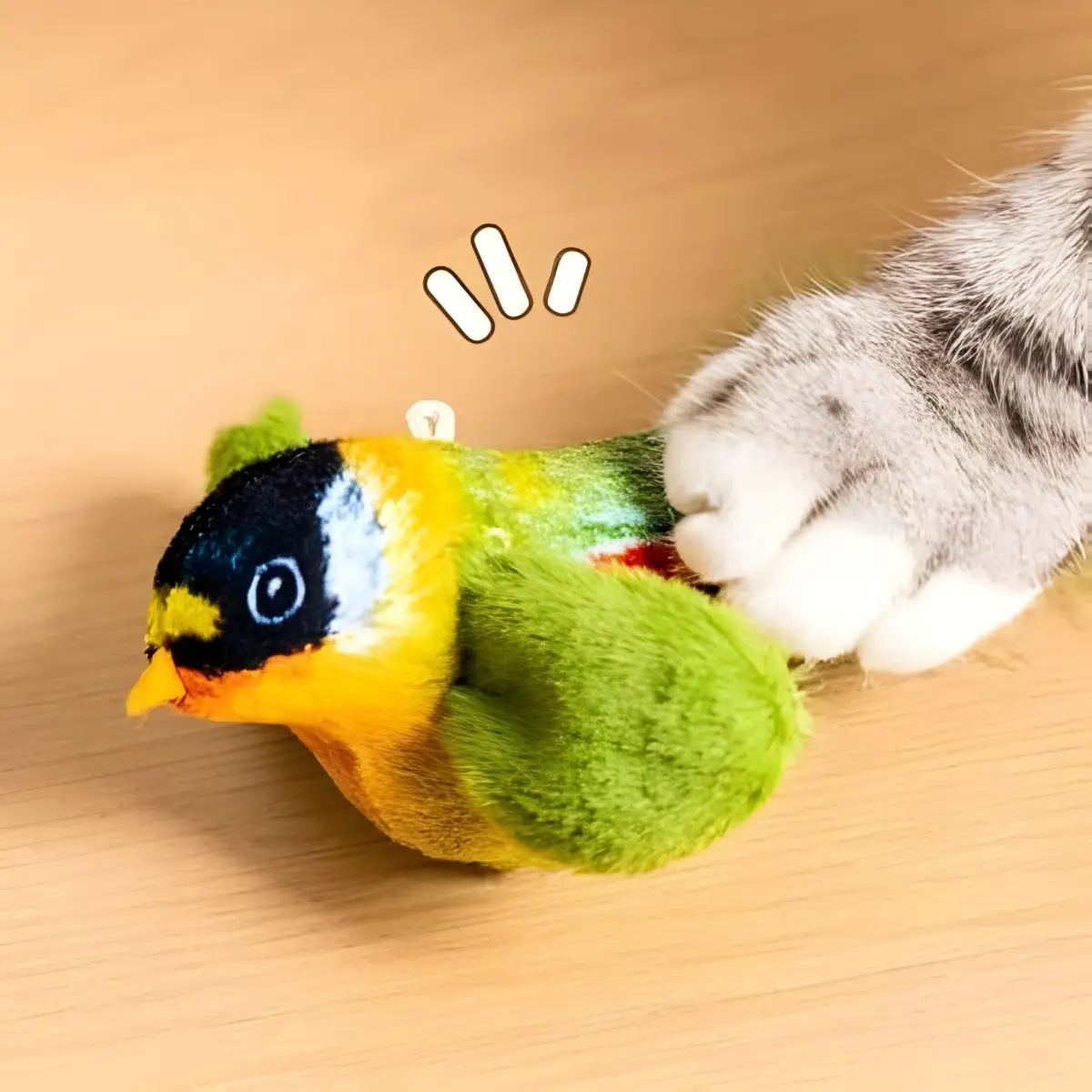 jouet pour chat en forme d'oiseau coloré avec une patte de chat qui joue avec