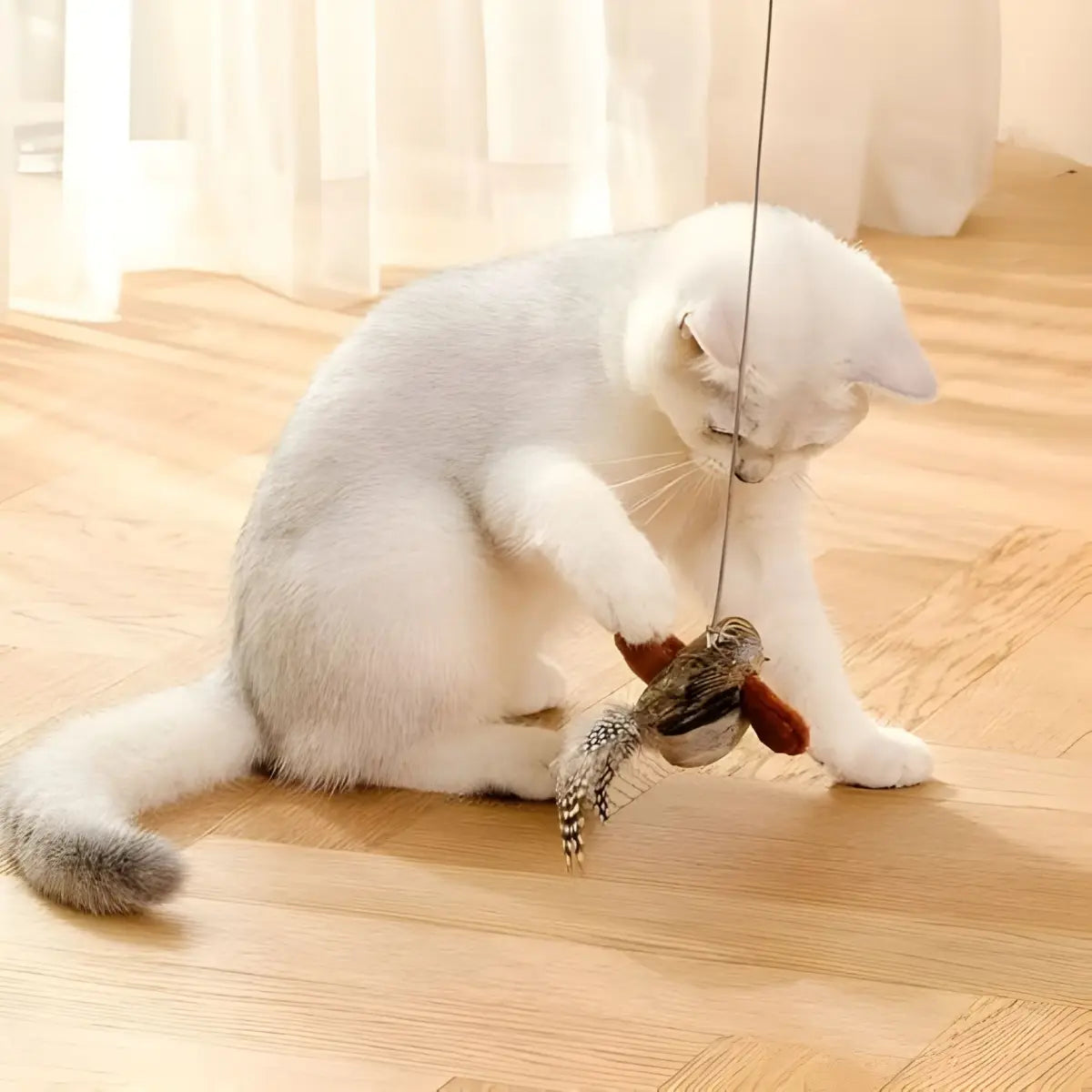 Jouet pour chat Plum’Chic™ avec plume et oiseau, idéal pour stimuler votre félin. - intérieur moderne