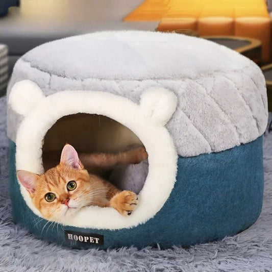niche pour chat transformable en panier douillet bleu et gris avec chat roux curieux