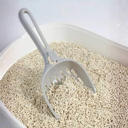 pelle a litiere pour chat en design gris incliné, idéale pour nettoyer la litière efficacement