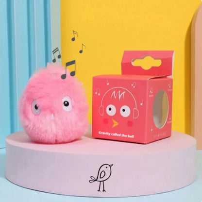 Peluche rose avec boîte design et notes de musique illustrées.
