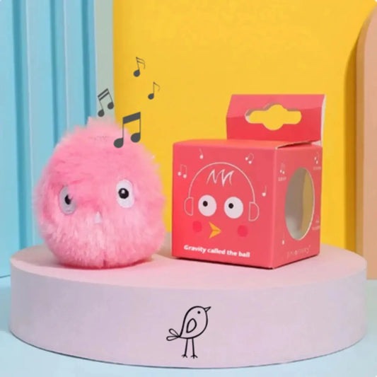 Peluche rose avec boîte design et notes de musique illustrées.